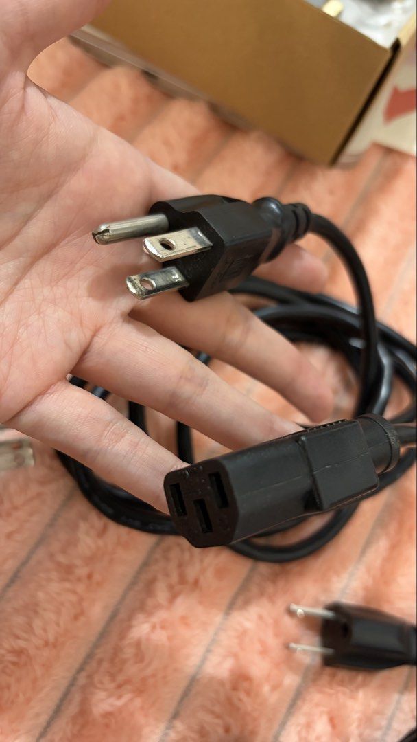 Power Cables - US Plug (Category: Cables & Adaptors) located in Mandaluyong City. Submitted by jaaustria20 (Listing ID 1429744666, Image 3). Description: Set of black power cables with US plugs. Includes multiple cables with the standard 3-prong plug on one end and the IEC C13 connector on the other. Suitable for various devices like computers, monitors, and other electronics..