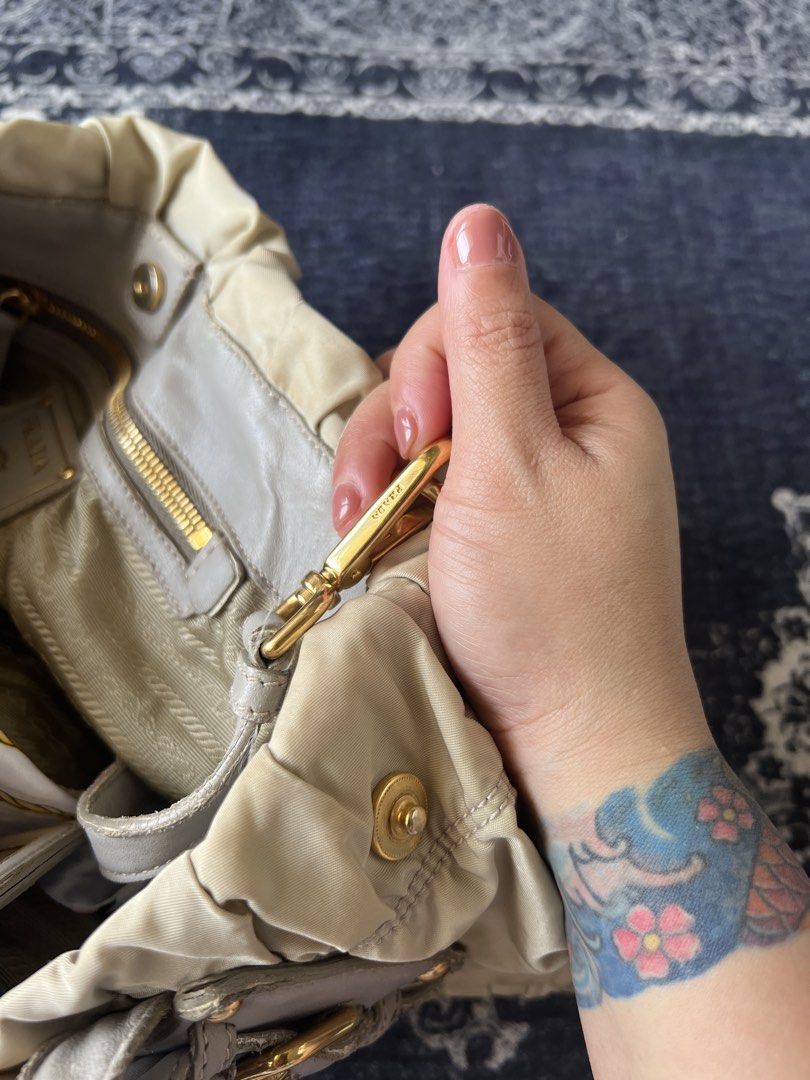 Prada Tessuto (Category: Luxury Bags & Wallets) located in Taguig. Submitted by rachelkristineee (Listing ID 1429704660, Image 2). Description: preloved original Prada Tessuto in Beige. Has visible peels on the leather parts. 15,000 php pick up loc: Acacia Estates, Taguig.