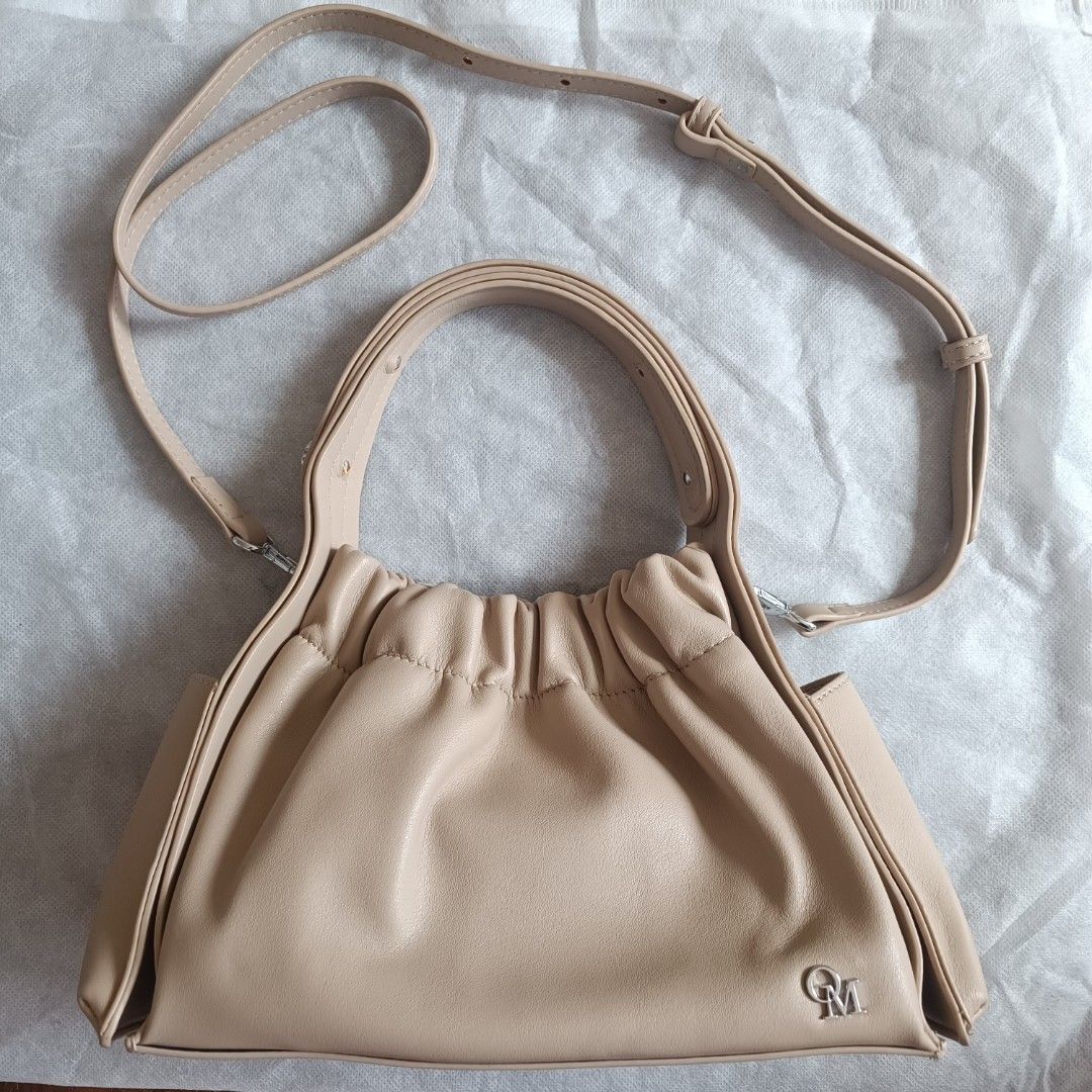 Queen of Material Jenner Bag (Category: Shoulder Bags) located in Quezon City. Submitted by firstlovedbyb (Listing ID 1429727076, Image 1). Description: Authentic Queen Of Material QOM Jenner Bag. Color: London Grey (beige in actual) Material: premium soft PU leather. With silver hardware. With long belt strap and adjustable top handle. Can be used as a sling bag, shoulder bag and hand bag. Bought in Bangkok, Thailand. No flaws. Good as new✨ Size