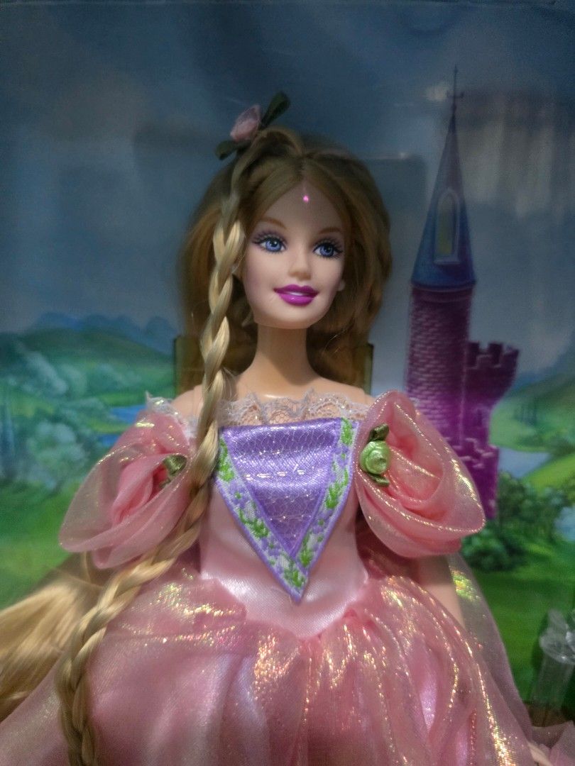 Rapunzel Collector Edition Barbie (Category: Figurines & Statues) located in Pasig City. Submitted by dolliesandpastels (Listing ID 1429835479, Image 2). Description: NRFB Box is not in the best condition (tear in front, creases, minimal scratches in the acetate plastic).