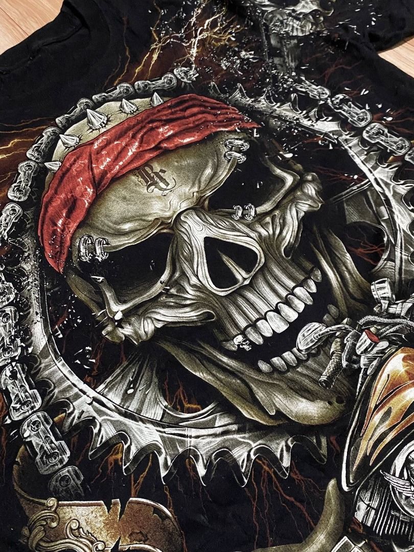 (Rock Chang) Skull Born to Ride (Category: Tshirts & Polo Shirts ) located in Calasiao. Submitted by dr.ginoo (Listing ID 1429815113, Image 3). Description: - Rock Chang Skull Born to Ride T-shirt - Black color - Features a detailed skull graphic - Design includes a skull with a red bandana, chains, and spark plug - issue : cut tags - minimal hair lines.