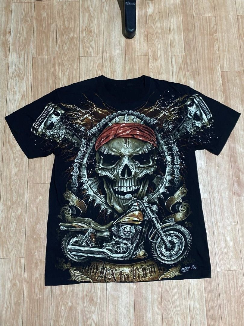 (Rock Chang) Skull Born to Ride (Category: Tshirts & Polo Shirts ) located in Calasiao. Submitted by dr.ginoo (Listing ID 1429815113, Image 1). Description: - Rock Chang Skull Born to Ride T-shirt - Black color - Features a detailed skull graphic - Design includes a skull with a red bandana, chains, and spark plug - issue : cut tags - minimal hair lines.