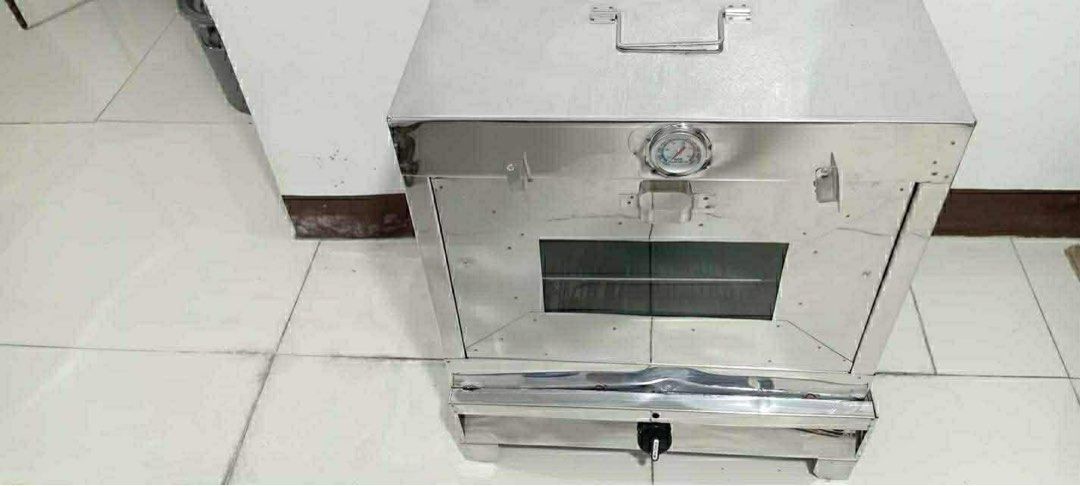 Stainless Steel Oven with Thermometer (Category: Ovens & Toasters) located in Manila. Submitted by vey1111 (Listing ID 1429749971, Image 1). Description: - Stainless steel oven - Built-in thermometer for precise temperature control - Includes multiple wire racks - Features a glass door for easy viewing - Portable with a top handle - Has a lower compartment - Ideal for baking and cooking nego for sure buyer..