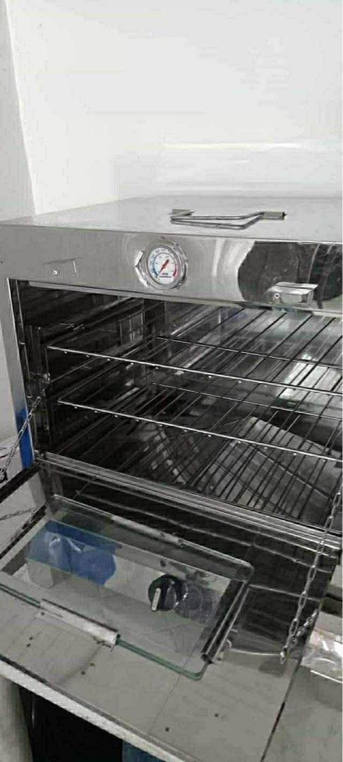 Stainless Steel Oven with Thermometer (Category: Ovens & Toasters) located in Manila. Submitted by vey1111 (Listing ID 1429749971, Image 2). Description: - Stainless steel oven - Built-in thermometer for precise temperature control - Includes multiple wire racks - Features a glass door for easy viewing - Portable with a top handle - Has a lower compartment - Ideal for baking and cooking nego for sure buyer..