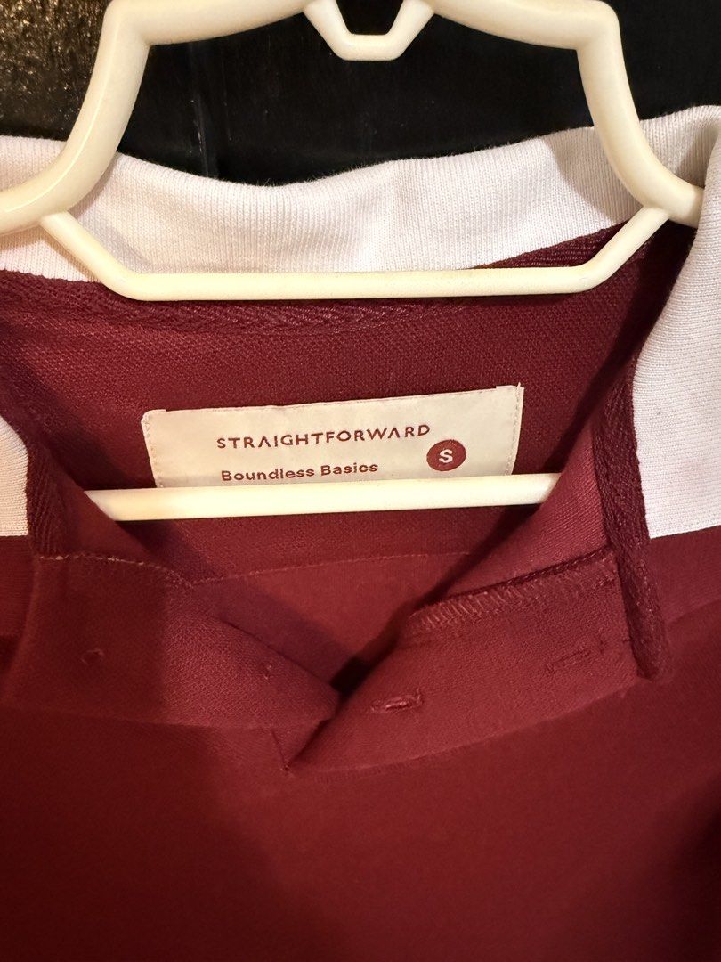 Straightforward Polo Shirt - Maroon (Category: Tshirts & Polo Shirts ) located in Paranaque City. Submitted by jayvee7 (Listing ID 1429675935, Image 2). Description: Maroon polo shirt from Straightforward. Features a white collar and sleeve trim. The shirt has a button-up neckline and is a size small. The shirt is a short-sleeved style. The brand tag is visible on the inside of the collar. Size Small RFS: Declutterring Only used once during Chris