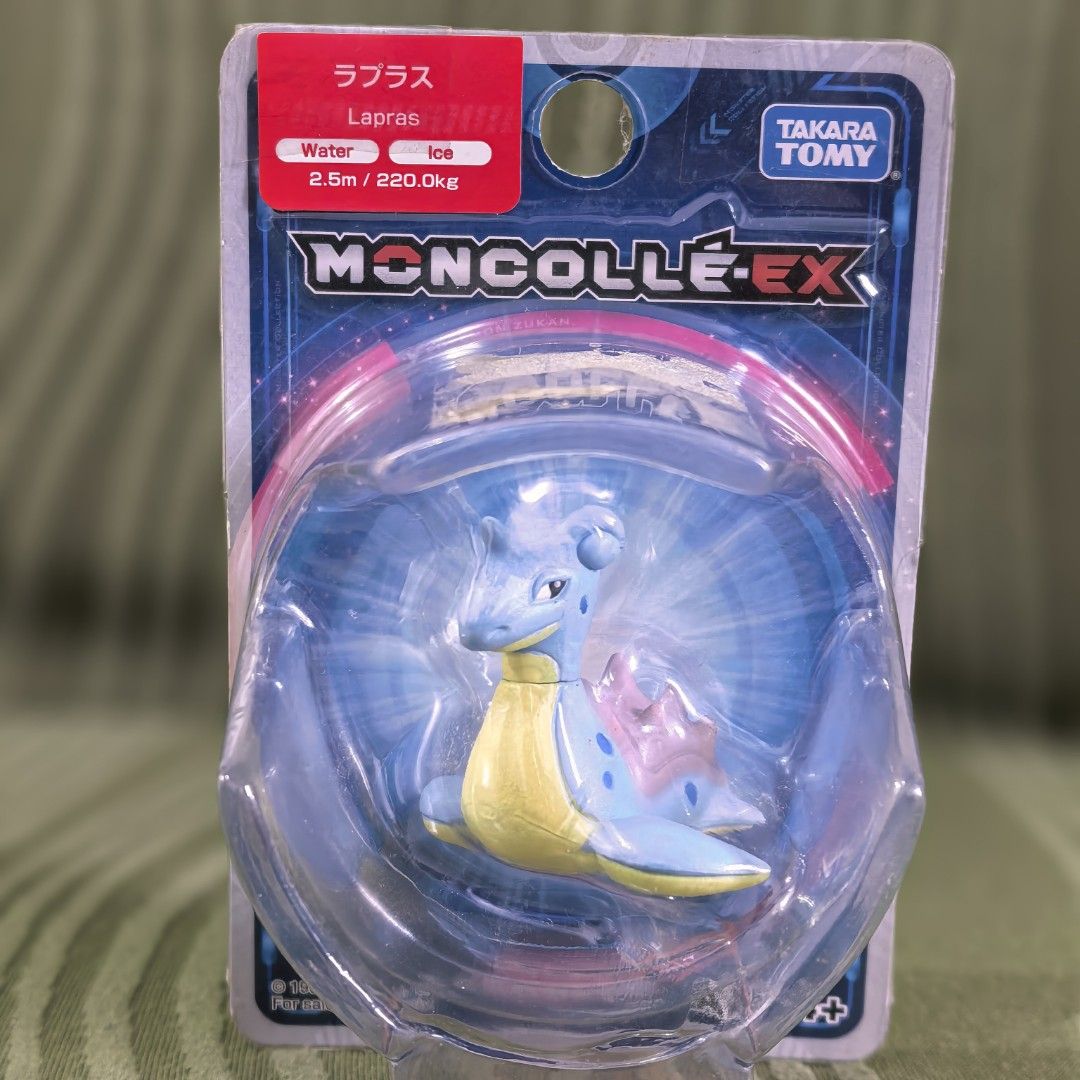 Takara Tomy Moncolle EX Lapras Figure (Category: Figurines & Statues) located in Manila. Submitted by kenslie (Listing ID 1429688403, Image 1). Description: Takara Tomy Moncolle EX figure of Lapras. The figure is still in its original packaging. It is a water and ice type Pokemon. The packaging includes a warning about small parts and is not suitable for children under 3 years old. The figure is made of PVC..
