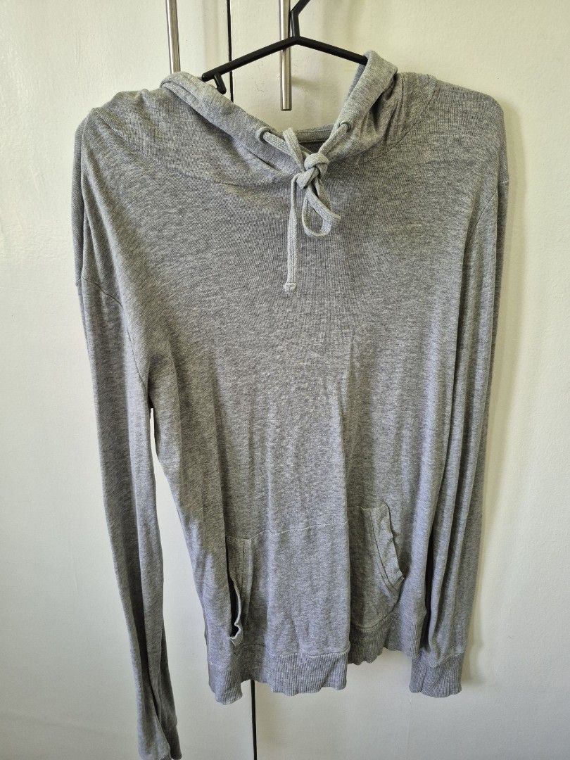 Terranova Gray Hoodie - Size L (Category: Others Tops) located in Valenzuela. Submitted by pappx (Listing ID 1429766221, Image 1). Description: Gray hoodie from Terranova. Features a hood with drawstrings and long sleeves. The size is Large. The hoodie has a pocket on the front. The overall design is simple and versatile..