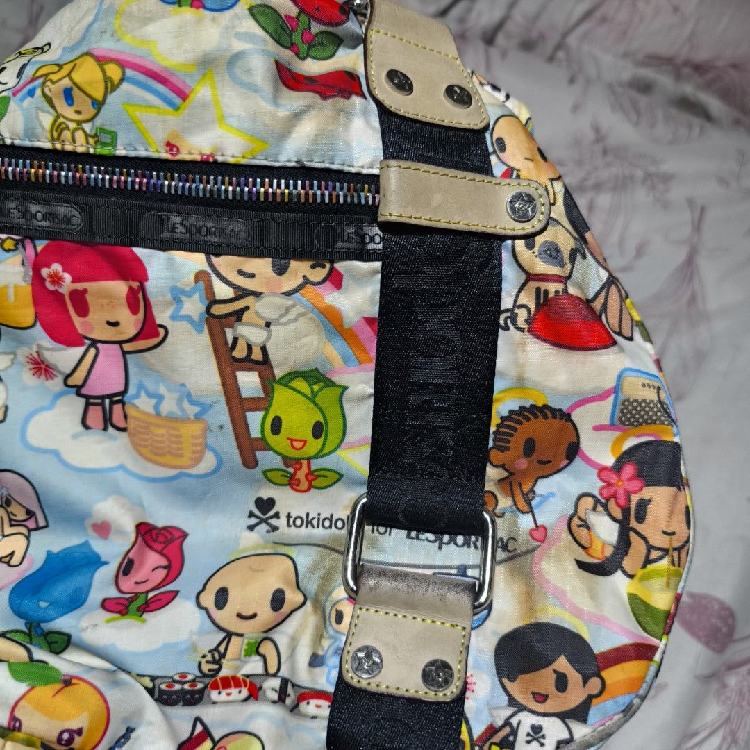 Tokidoki for LeSportsac Handbag (Category: Shoulder Bags) located in Manila. Submitted by yui021 (Listing ID 1429670278, Image 3). Description: - LeSportsac shoulder bag features a colorful Tokidoki print. - I used to use this back in highschool, and I wasn't very careful with it. Bag has a lot of discolorations outside and inside (pen marks). Flaws are shown in the pictures, but can provide more photos. - This is still amazing quality, it's just
