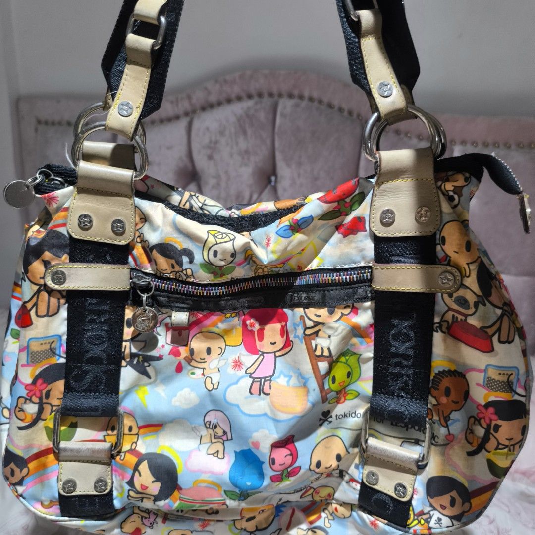 Tokidoki for LeSportsac Handbag (Category: Shoulder Bags) located in Manila. Submitted by yui021 (Listing ID 1429670278, Image 1). Description: - LeSportsac shoulder bag features a colorful Tokidoki print. - I used to use this back in highschool, and I wasn't very careful with it. Bag has a lot of discolorations outside and inside (pen marks). Flaws are shown in the pictures, but can provide more photos. - This is still amazing quality, it's just