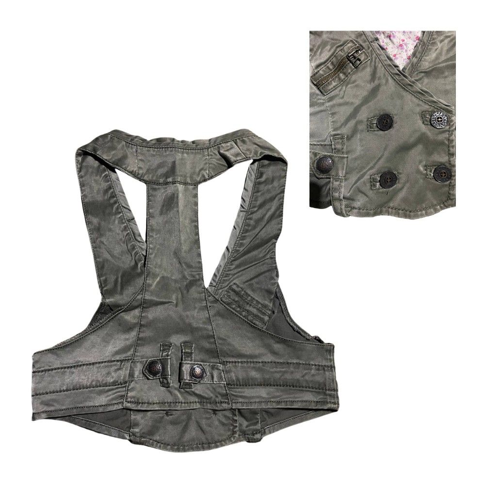 Tough Jeansmith Green Vest (Category: Others Tops) located in Manila. Submitted by rackofyuu (Listing ID 1427308792, Image 2). Description: Measurements: W - 28 inches L - 16 inches MOP: GCash Stylish vest from Tough Jeansmith. Features a unique design, a double-breasted front with buttons. Includes two front pockets and a small zippered pocket. The vest has a halter-style neckline. The color is a muted olive green. Perfect for layering..