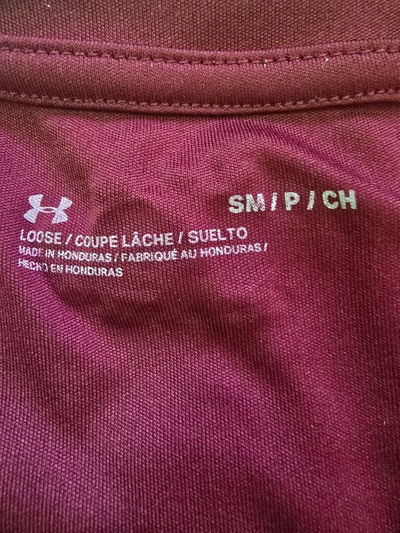 Under Armour Loose Fit T-Shirt (Category: Tshirts & Polo Shirts ) located in Quezon City. Submitted by jb0516 (Listing ID 1429692976, Image 3). Description: Maroon Under Armour t-shirt. Features the Under Armour logo on the front. The shirt is size SM/CH. Made in Honduras. The shirt has short sleeves and a crew neck..