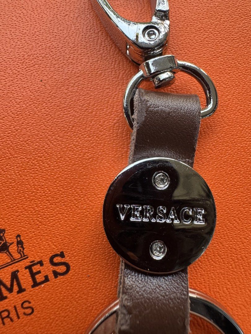 Versace Leather Key Chain (Category: Luxury Accessories) located in Makati City. Submitted by ehloysah (Listing ID 1429703106, Image 2). Description: - Versace Leather Key Chain - Unisex design - Features the iconic Versace logo - A stylish and functional accessory.
