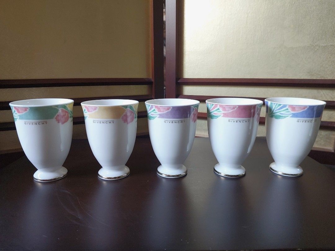 Vintage Givenchy Footed Porcelain Cup Set (Category: Coffee & Tea Tableware) located in Bulacan. Submitted by hnbfinds (Listing ID 1429725588, Image 1). Description: Elevate your table setting with this vintage Givenchy footed porcelain cup set. 🌸 Each of the five pieces features a unique, delicate floral rim and elegant gold-lined base, blending Parisian luxury with Japanese craftsmanship. Perfect for tea, juice, or simply as a stunning display