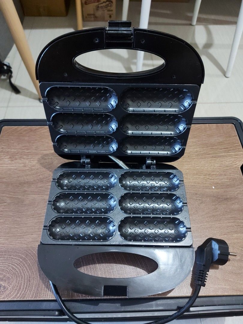 Waffle Maker / Hot dog maker / Sandwich waffle breakfast maker (Category: Breadmakers) located in Makati City. Submitted by bambuyvee (Listing ID 1429696984, Image 2). Description: Sokany Waffle Maker Non Stick weight: 1.4 kg size: 25x25x8 cm Used only trice or thrice RFS: Decluttering/Not using anymore Price negotiable.