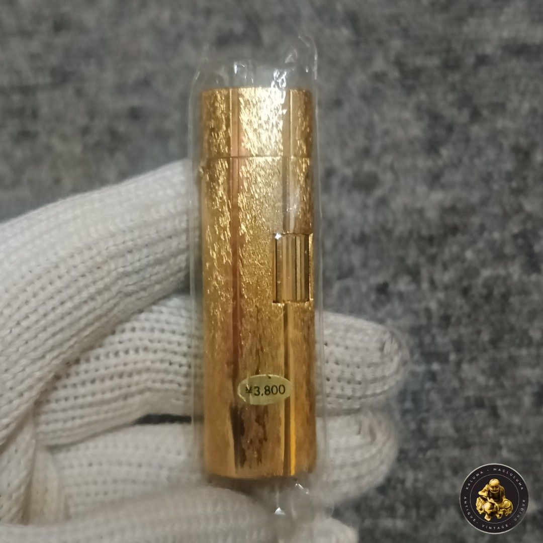 Zaima C-20 Gold Lighter (Category: Everything Else Others) located in Meycauayan. Submitted by ka_luma (Listing ID 1429686894, Image 1). Description: Gold-colored Zaima C-20 lighter. The lighter has a textured surface and a flip-top design. The bottom of the lighter has the brand name and model number..