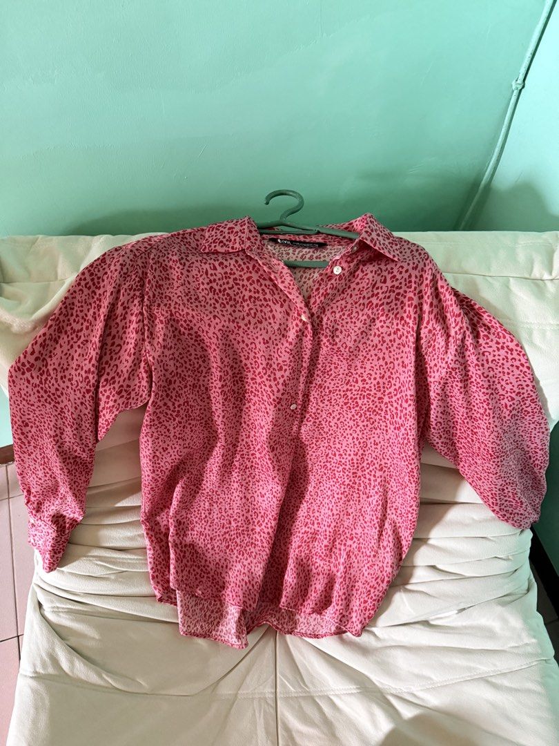 Zara Animal Print Blouse (Category: Blouses) located in Cainta. Submitted by Kamilerloo (Listing ID 1429699554, Image 1). Description: Pink animal print blouse from Zara. Features a collared neckline and long sleeves. The size is XS. Made in Indonesia. The blouse has a button-down closure. The blouse has a classic, versatile design. RFS: decluttering.