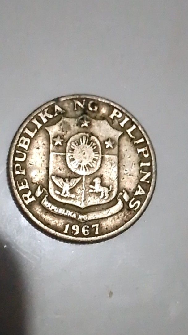 1967 25 Sentimos Coin (Category: Currency) located in Valenzuela. Submitted by eugenioarellano (Listing ID 1433382792, Image 1). Description: - 1967 25 Sentimos coin from the Philippines. - Features the Philippine coat of arms. - Features a portrait of Juan Luna. - Denomination: 25 Sentimos. - Year: 1967..
