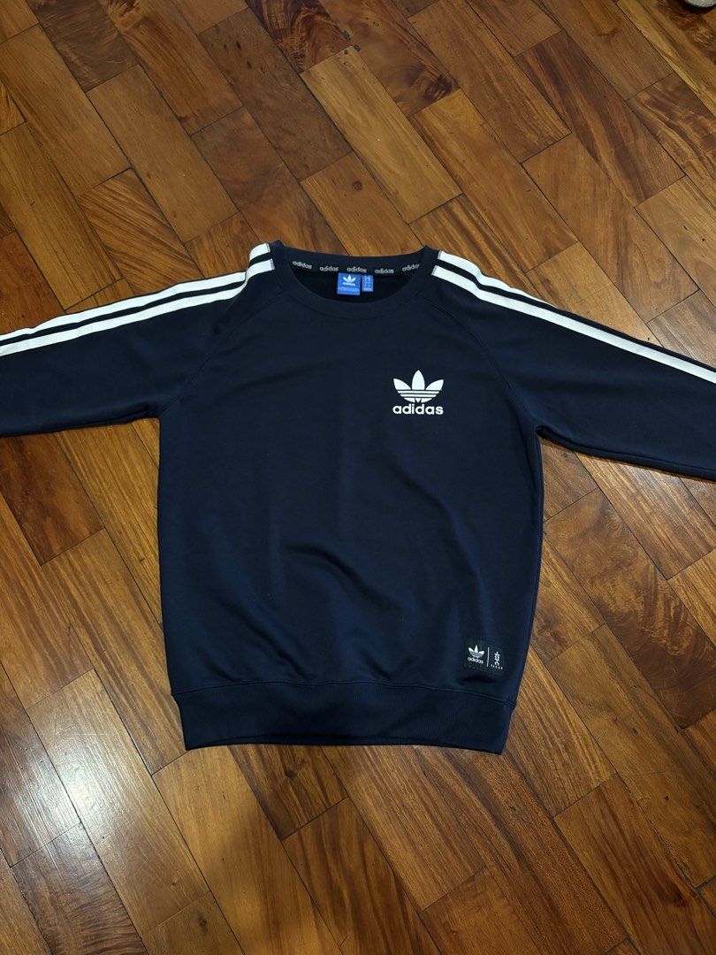 Adidas 3-Stripes Crew Sweatshirt - Navy Blue (Category: Coats, Jackets and Outerwear) located in Pasig City. Submitted by mvsdb (Listing ID 1433302983, Image 2). Description: ORIGINAL AUTHENTIC - Adidas crew sweatshirt - Navy blue with white stripes - Adidas logo on chest - Size M - Adidas logo on neckline - Comfortable fabric.