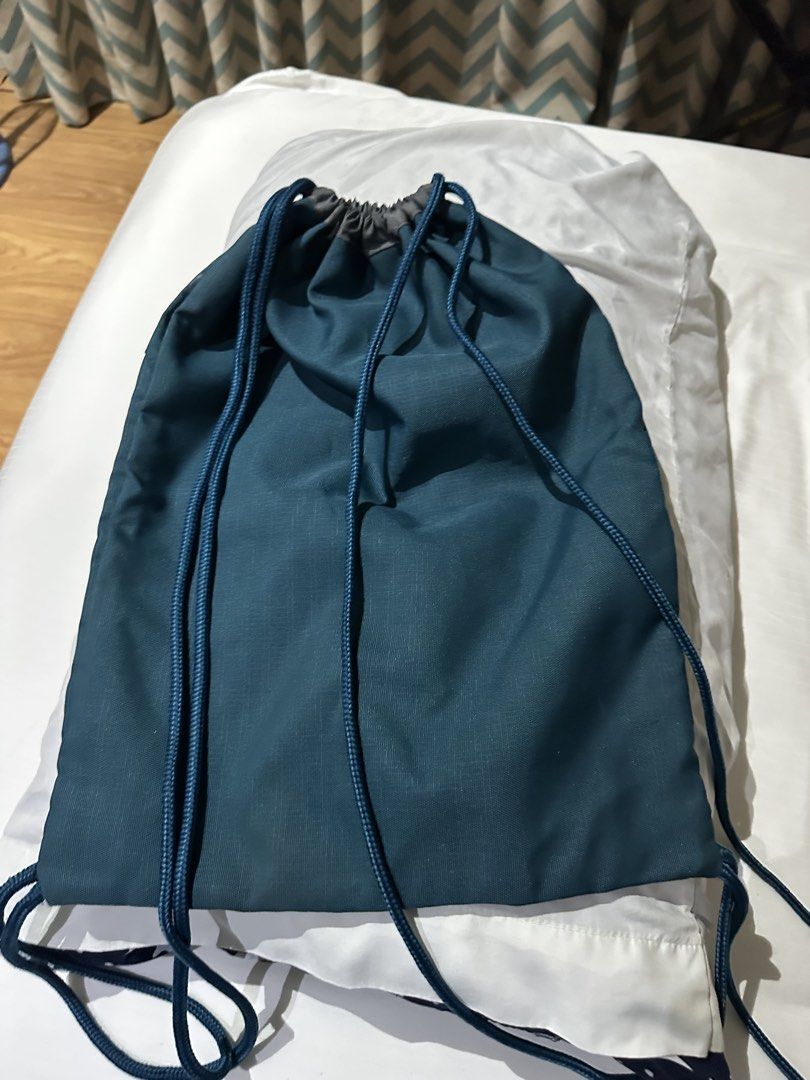 Adidas Drawstring Bag (Category: Backpacks) located in Manila. Submitted by qualitypreluvd (Listing ID 1433342644, Image 3). Description: - Adidas teal drawstring bag - Gold Adidas logo - Zippered front pocket - Drawstring closure - Small hanging loop - Adidas logo on zipper - Ideal for gym clothes and essentials.
