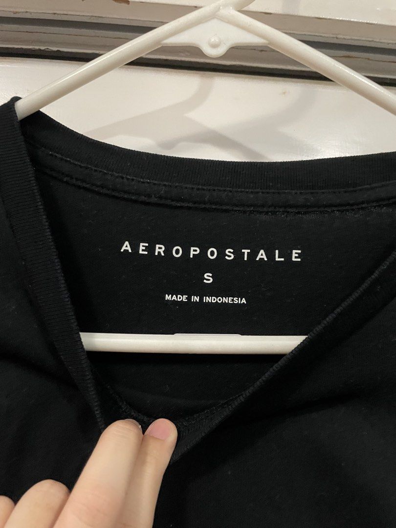 Aeropostale Black T-shirt (Category: Shirts) located in Makati City. Submitted by Pinksisters (Listing ID 1433359644, Image 2). Description: - Aeropostale black t-shirt - Size: Small but fits medium - Features a small logo on the front - Classic crew neck design - Short sleeves - Made in Indonesia.