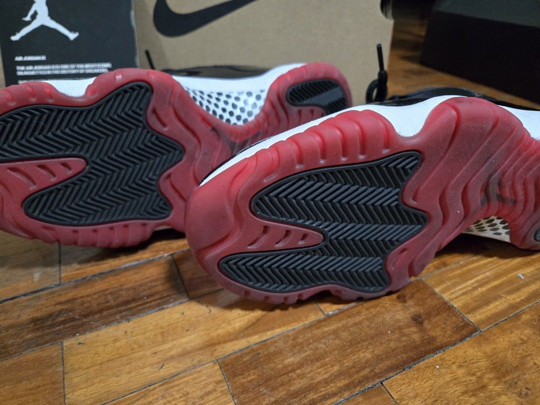 Air Jordan 11 Retro Black/True Red-White (Category: Sneakers) located in Mandaluyong City. Submitted by darkc7oud (Listing ID 1433322352, Image 2). Description: - Air Jordan 11 Retro sneakers - Colorway: Black, Red, and White - Features: Black mesh upper, patent leather detailing - Soles: Red and white - Size: 8 - Includes original box.