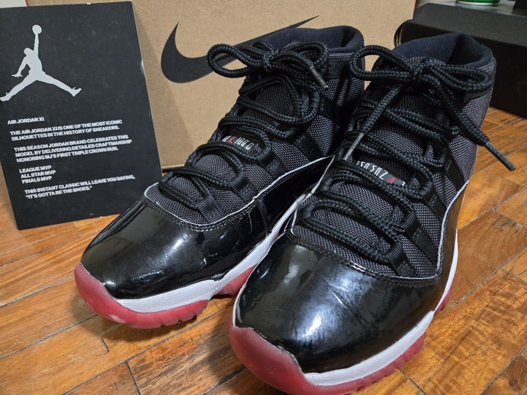 Air Jordan 11 Retro Black/True Red-White (Category: Sneakers) located in Mandaluyong City. Submitted by darkc7oud (Listing ID 1433322352, Image 1). Description: - Air Jordan 11 Retro sneakers - Colorway: Black, Red, and White - Features: Black mesh upper, patent leather detailing - Soles: Red and white - Size: 8 - Includes original box.