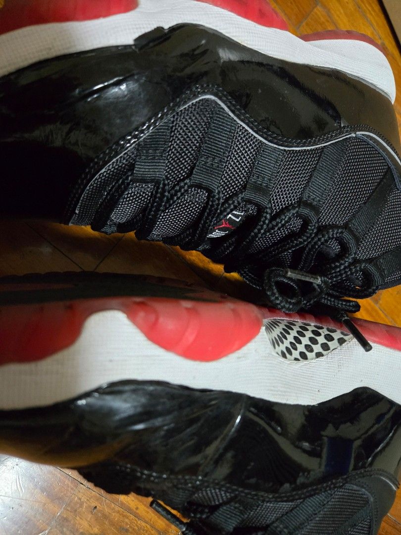 Air Jordan 11 Retro Black/True Red-White (Category: Sneakers) located in Mandaluyong City. Submitted by darkc7oud (Listing ID 1433322352, Image 3). Description: - Air Jordan 11 Retro sneakers - Colorway: Black, Red, and White - Features: Black mesh upper, patent leather detailing - Soles: Red and white - Size: 8 - Includes original box.