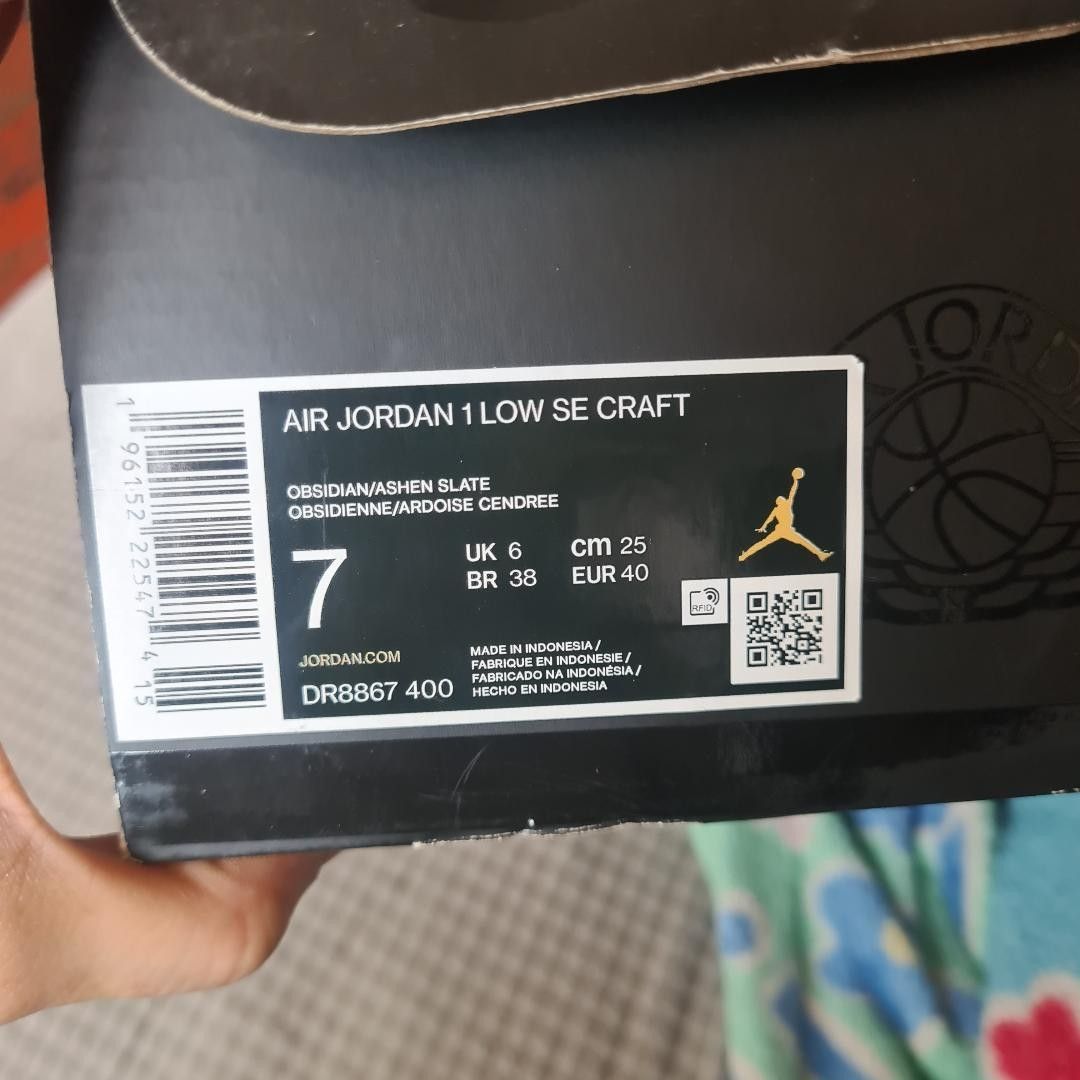 Air Jordan 1 Low SE Craft Obsidian (Category: Sneakers) located in Manila. Submitted by jaczac (Listing ID 1433374525, Image 1). Description: - Air Jordan 1 Low SE Craft - Colorway: Obsidian/Ashen Slate - Size: 7 - Features blue and grey color scheme - Air Jordan logo on heel - Comes with original box.