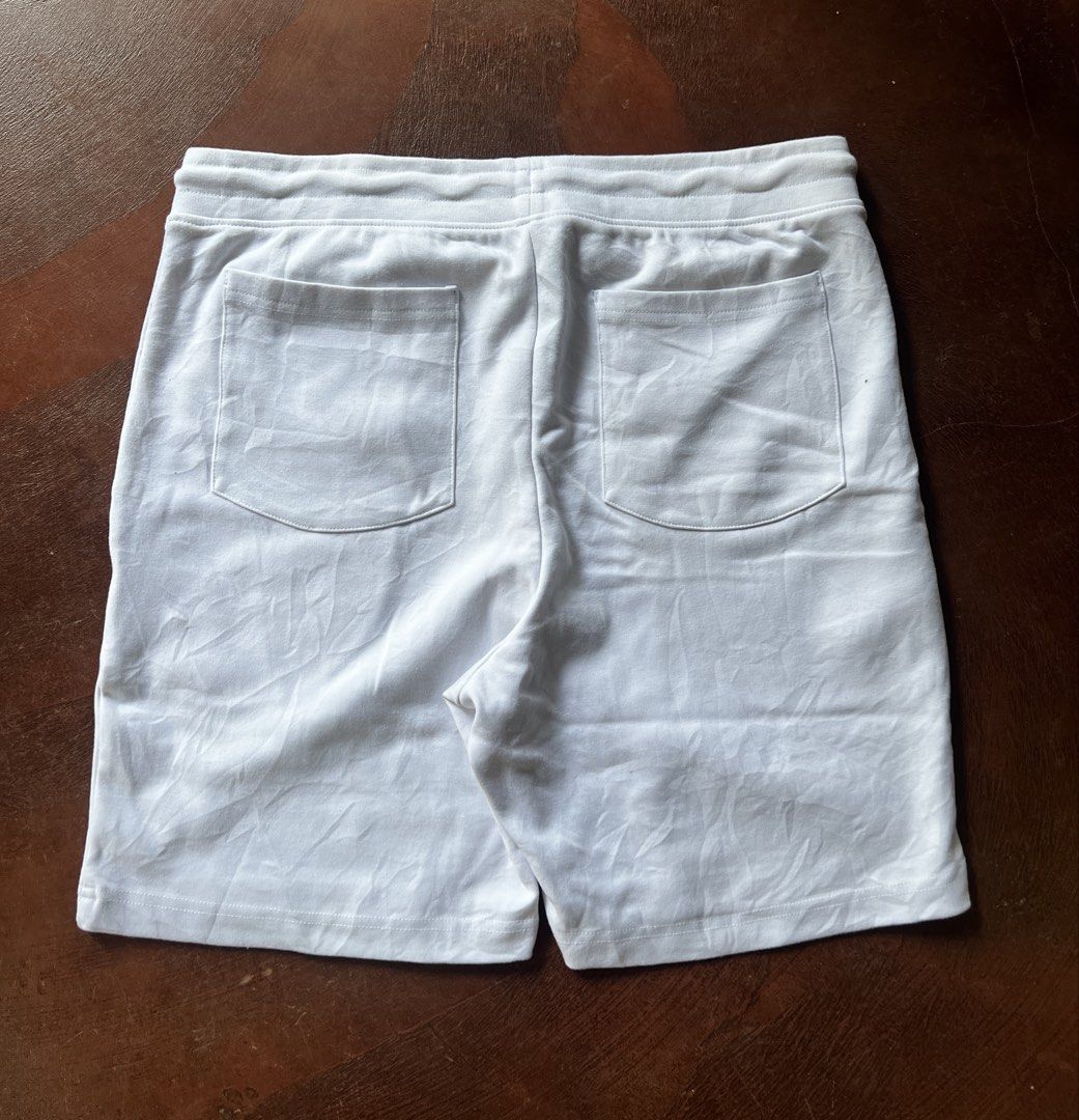 Alphalete White Shorts - Size L (Category: Activewear) located in Nabua. Submitted by gandathriftstore (Listing ID 1433215310, Image 3). Description: - White Alphalete shorts - Size: L - Features: - Drawstring waist - Alphalete logo - Two back pockets - Material: Cotton-elastane blend - Care: Machine washable.