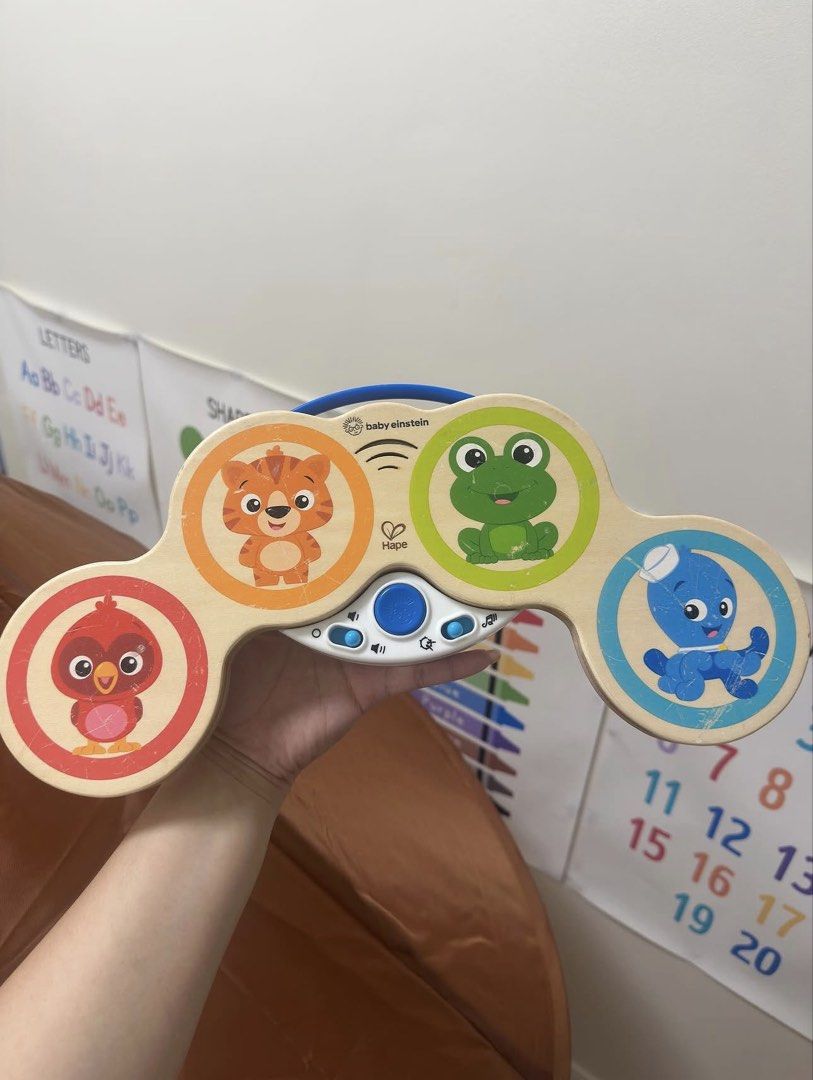 Baby Einstein Hape Musical Toy (Category: Educational & Learning Toys) located in Cavite. Submitted by alyssa_mae (Listing ID 1433316780, Image 1). Description: - Baby Einstein musical toy - Features colorful animal characters - Plays various sounds and music - Designed with a handle for easy carrying - Made of wood and plastic.