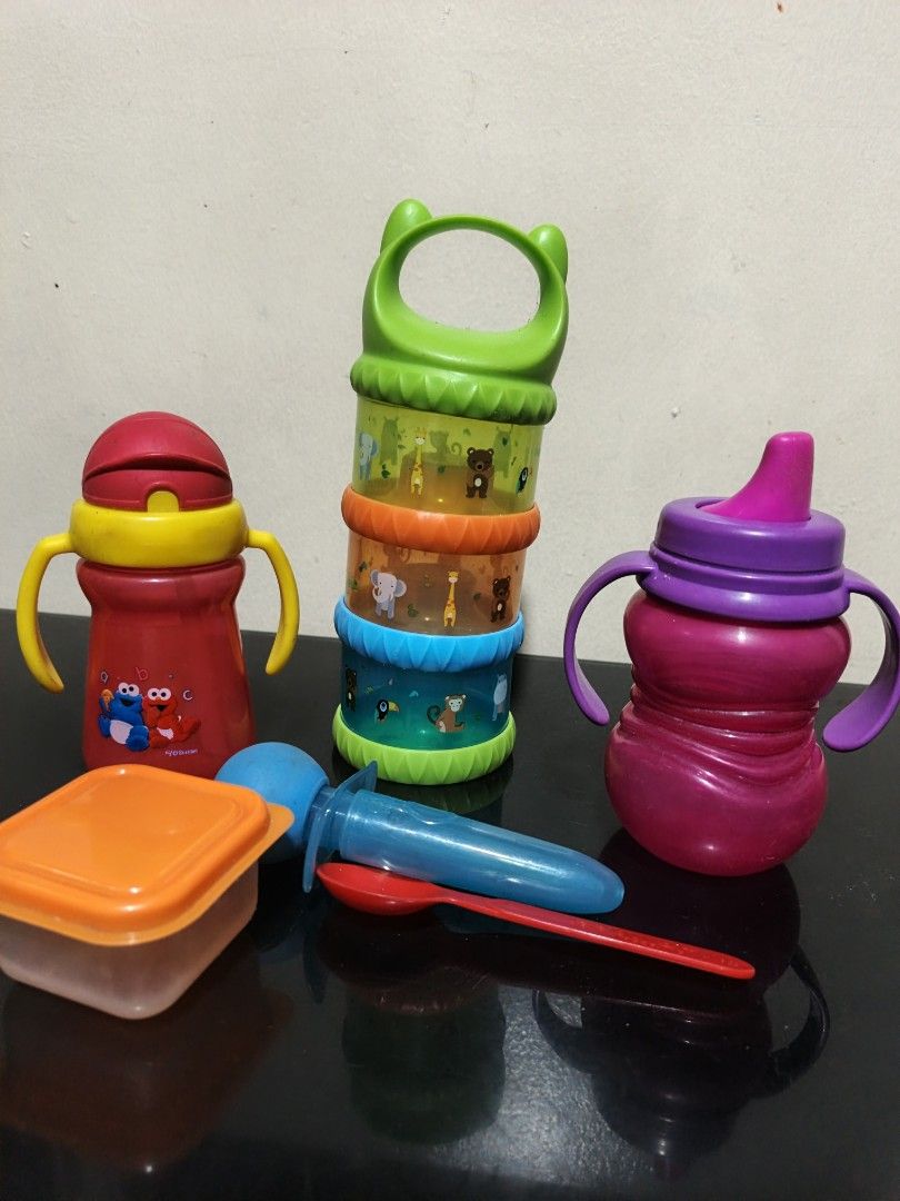 Baby Feeding Set - Sippy Cups, Snack Container, Spoon take all (Category: Weaning & Toddler Feeding) located in Marikina City. Submitted by andreah_16 (Listing ID 1433342096, Image 2). Description: - Includes two sippy cups (red and purple) with handles - Features a snack container - Comes with a colorful stacking container - Includes a spoon - Ideal for feeding your baby at home or while traveling.