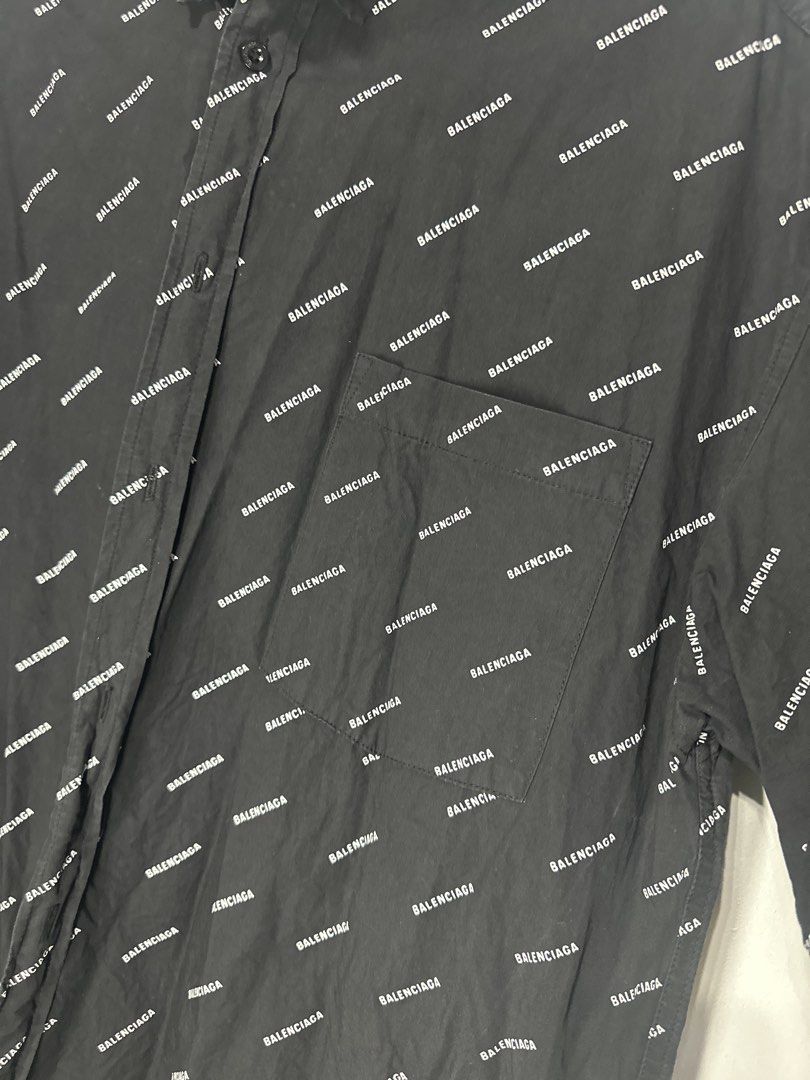 Balenciaga All Over Logo Shirt (Category: Tshirts & Polo Shirts ) located in Batangas. Submitted by jim2621 (Listing ID 1433217882, Image 3). Description: - Balenciaga shirt with all-over logo print - Black, short-sleeved - Features a button-down closure and chest pocket - Size 52 - Made in Portugal - Branded buttons - Classic collar Oversized.