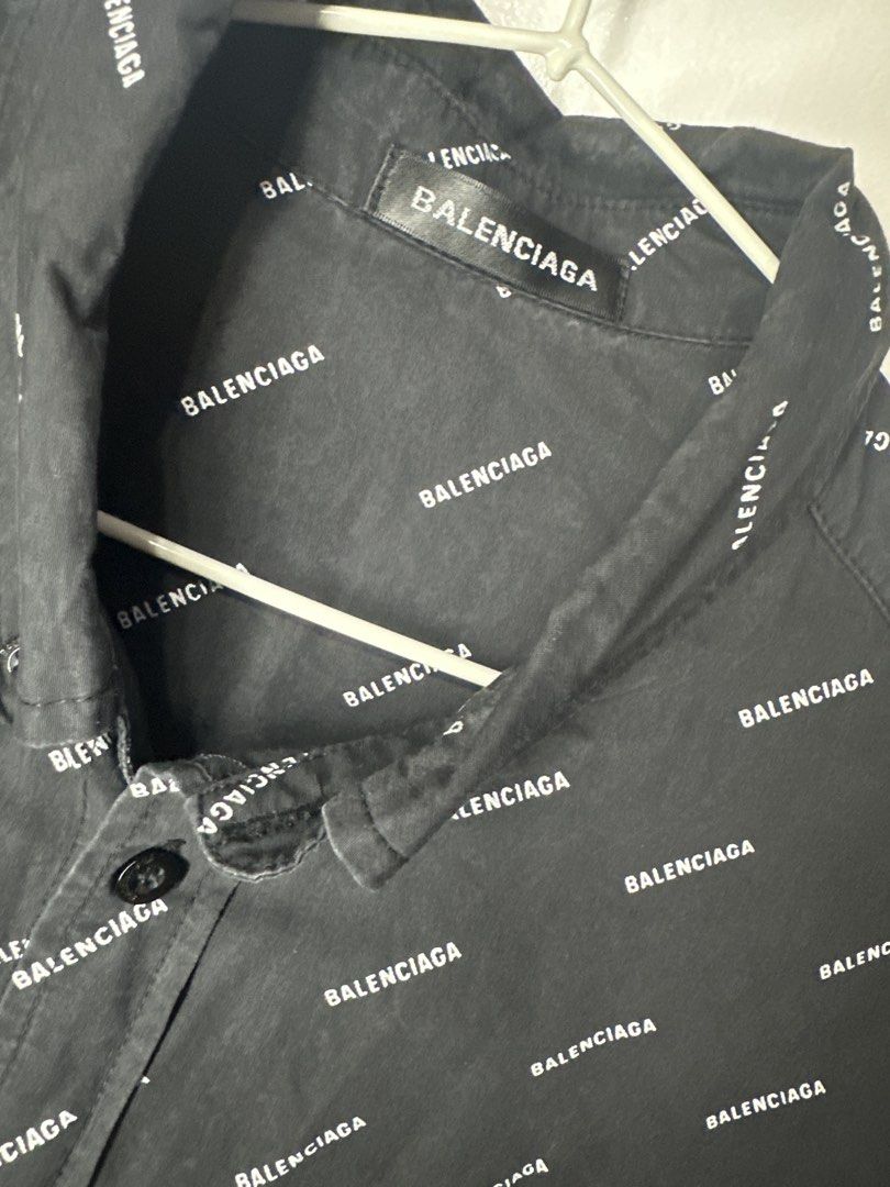 Balenciaga All Over Logo Shirt (Category: Tshirts & Polo Shirts ) located in Batangas. Submitted by jim2621 (Listing ID 1433217882, Image 2). Description: - Balenciaga shirt with all-over logo print - Black, short-sleeved - Features a button-down closure and chest pocket - Size 52 - Made in Portugal - Branded buttons - Classic collar Oversized.