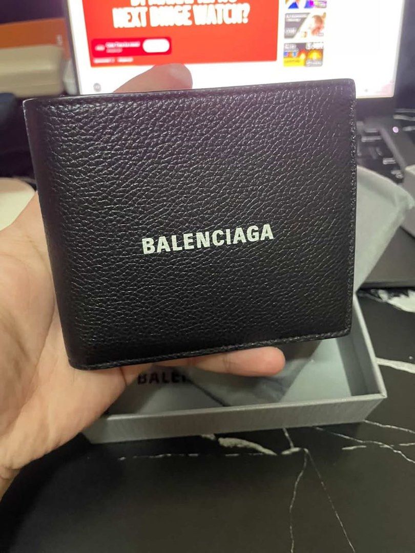 Balenciaga Black Leather Wallet (Category: Luxury Bags & Wallets) located in Manila. Submitted by mzzzxxxx.41 (Listing ID 1433264137, Image 1). Description: - Authentic Balenciaga wallet - Black leather - Balenciaga logo on front - Includes original box, dust bag, and care cards - Multiple card slots and bill compartments - Unused condition.