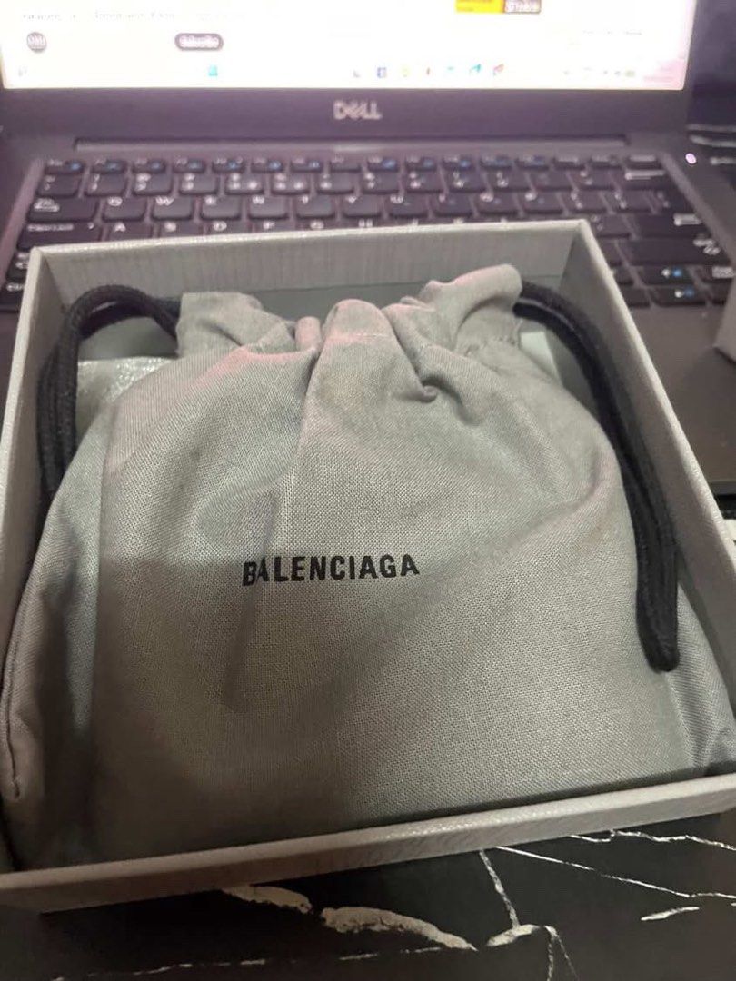Balenciaga Leather Wallet (Category: Luxury Bags & Wallets) located in Manila. Submitted by mzzzxxxx.41 (Listing ID 1433304688, Image 2). Description: - Authentic Balenciaga wallet - Color: Black - Includes: Dust bag, box, and authenticity cards - Features: - Multiple card slots - Bill compartment - Balenciaga logo visible - Comes with original packaging.