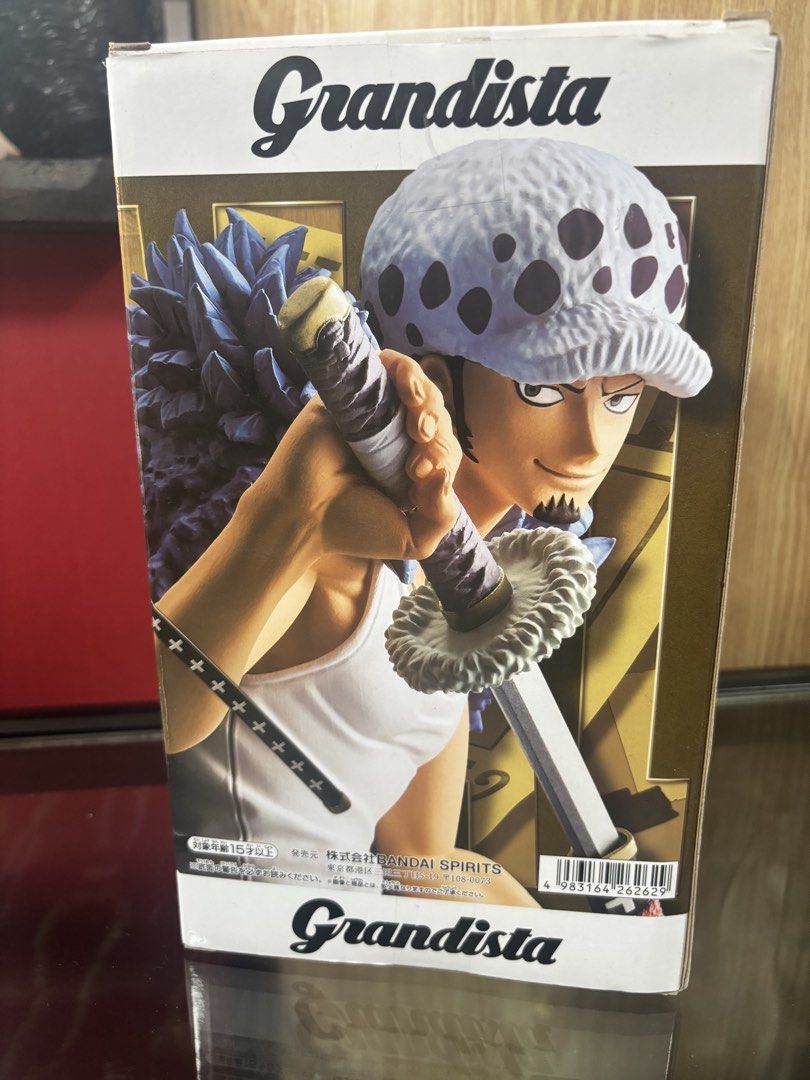 Bandai Grandista Trafalgar Law Figure (Category: Toy Figures) located in Singapore. Submitted by rachelzhan85416 (Listing ID 1433299488, Image 2). Description: - Brand new, unopened Bandai Grandista Trafalgar Law figure. - Features detailed sculpting and vibrant colors. - Perfect for One Piece fans and collectors. - Box in excellent condition..