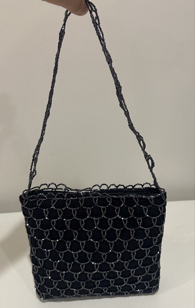 Black Beaded Handbag (Category: Purses & Pouches) located in Manila. Submitted by caseller26 (Listing ID 1433326585, Image 2). Description: - Elegant black handbag - Beaded design - Structured square shape - Beaded handle - Stylish accessory.