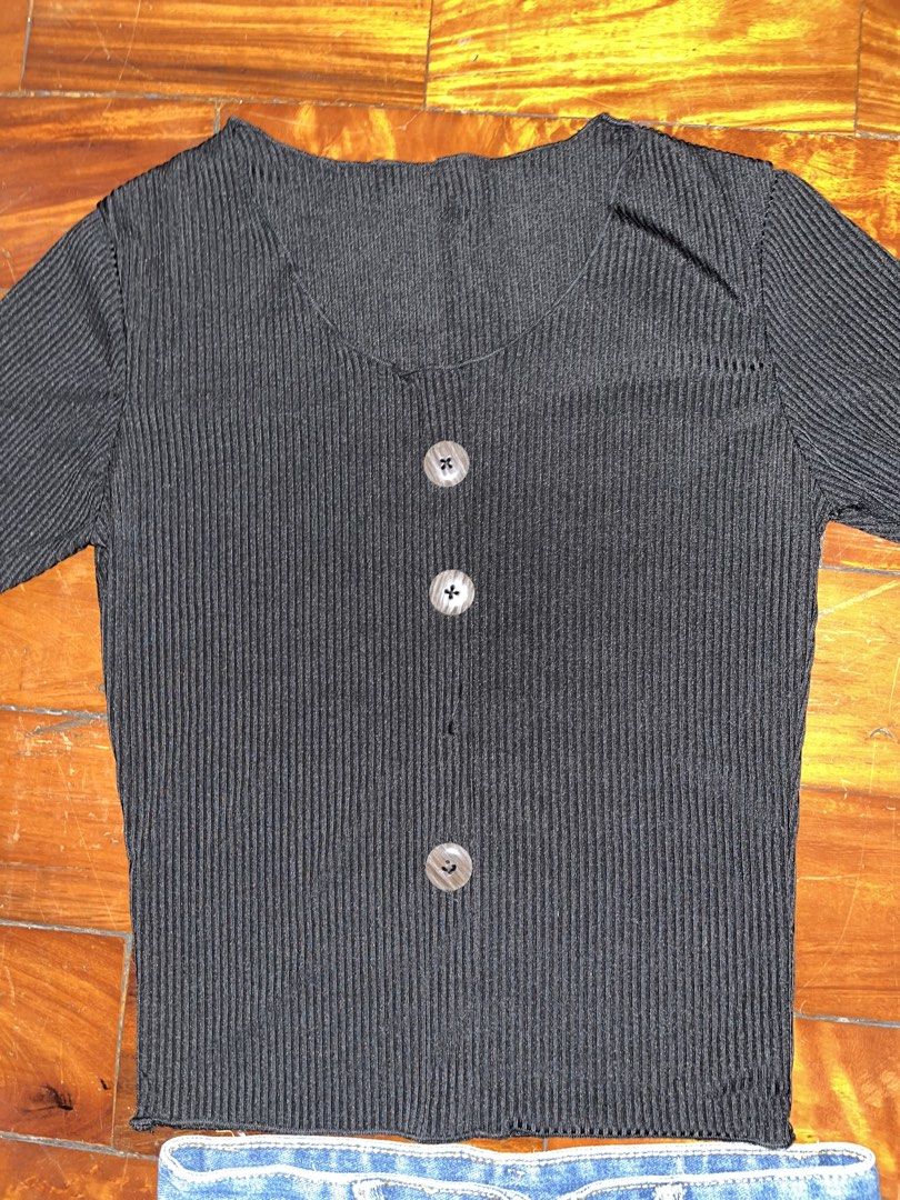 Black Ribbed Top with missing button (Category: Blouses) located in Manila. Submitted by declitterclutter (Listing ID 1433261876, Image 3). Description: - Black ribbed top with button details - Short sleeves and scoop neckline - Classic denim mini skirt - Perfect for casual wear - Versatile addition to your wardrobe.