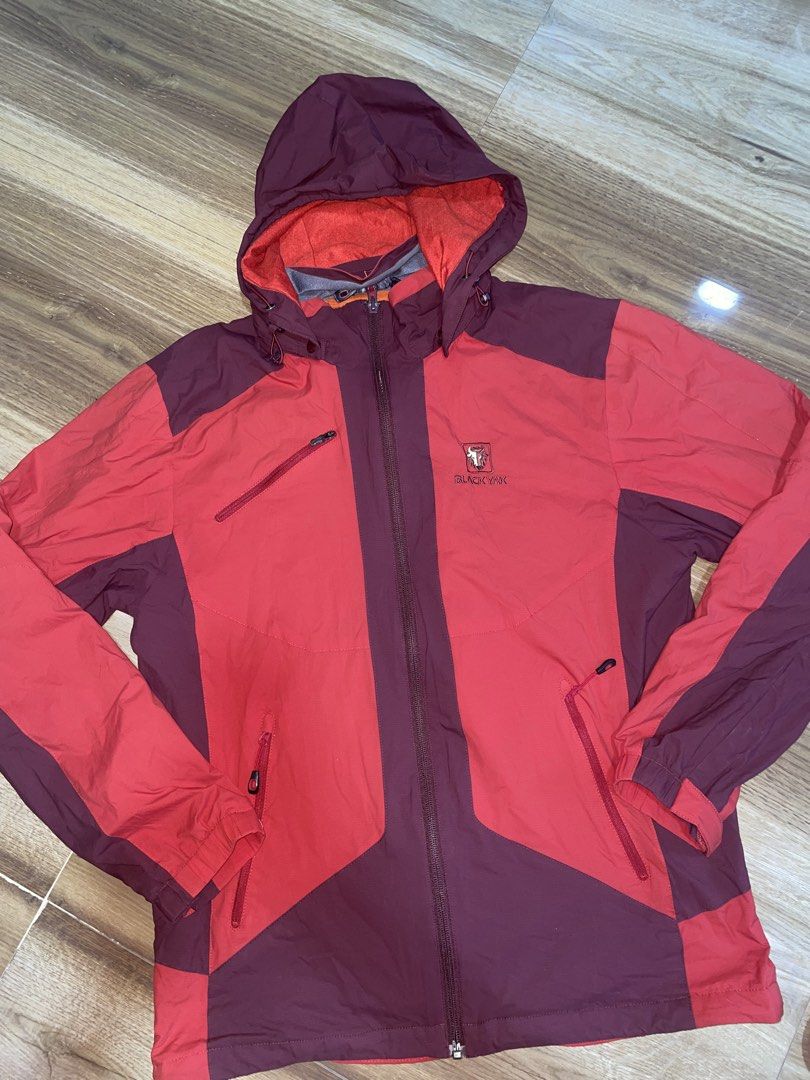 Black Yak Jacket with Hood (Category: Coats, Jackets and Outerwear) located in Manila. Submitted by clementdav22513 (Listing ID 1433306342, Image 1). Description: - Black Yak hooded jacket - Red and maroon color scheme - Full-zip closure - Multiple pockets - Durable, possibly waterproof material - Orange interior lining - Black Yak logo on chest.