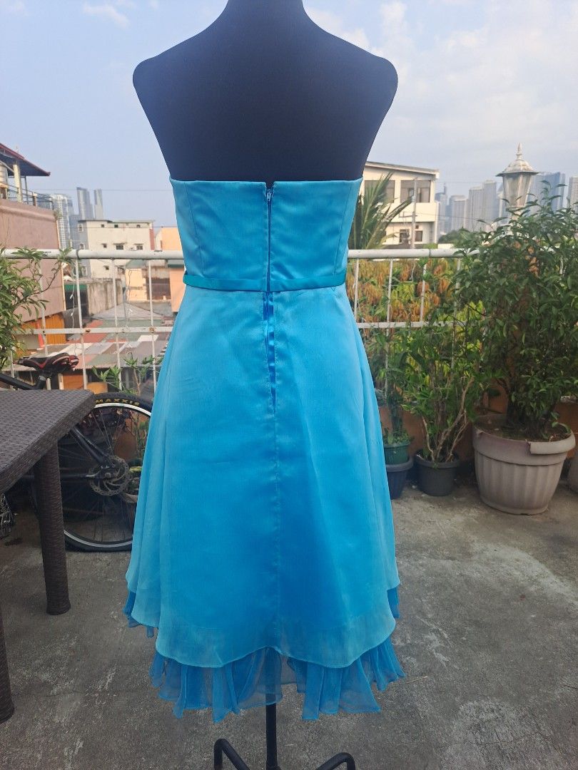 Blue Strapless Cocktail Dress (Category: Dresses) located in Manila. Submitted by maggie54145 (Listing ID 1433297566, Image 2). Description: - 47 cm / 18 inches bust size - 39 inches length - 32-36 inches waistline - Elegant blue strapless cocktail dress - Fitted bodice with waist embellishment - Layered skirt with ruffled hem - Includes a matching shawl - Perfect for special occasions.