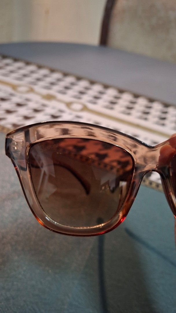 Brown Sunglasses with Case (Category: Sunglasses & Eyewear) located in Las Pinas. Submitted by mgr29 (Listing ID 1433335827, Image 3). Description: - Stylish brown sunglasses - Gradient lenses - Includes blue case and cleaning cloth - Perfect for everyday use.