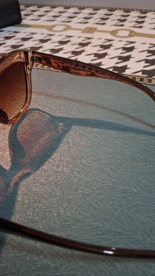 Brown Sunglasses with Case (Category: Sunglasses & Eyewear) located in Las Pinas. Submitted by mgr29 (Listing ID 1433335827, Image 2). Description: - Stylish brown sunglasses - Gradient lenses - Includes blue case and cleaning cloth - Perfect for everyday use.
