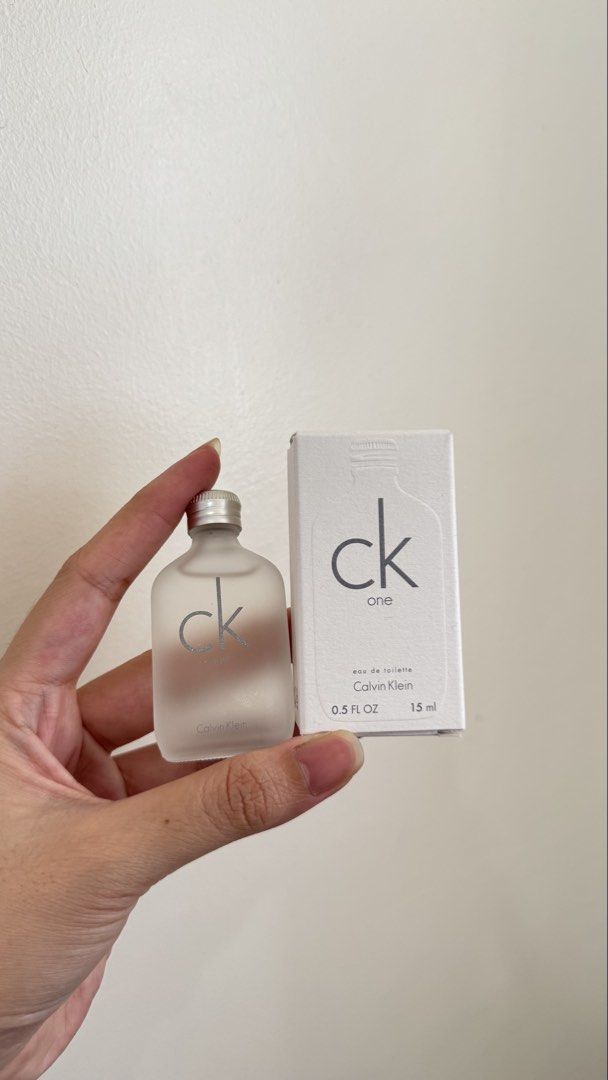 Calvin Klein CK One Eau de Toilette 15ml (Category: Fragrance & Deodorants) located in Bacolod City. Submitted by henna_preloved (Listing ID 1433290748, Image 1). Description: - Calvin Klein CK One Eau de Toilette - 15ml bottle (0.5 FL OZ) - Frosted glass bottle with silver cap - Comes in original white box - Features the CK One logo and product information.