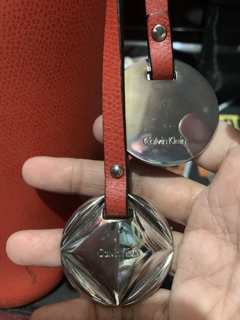 Calvin Klein Red Handbag/backpack (Category: Luxury Bags & Wallets) located in Quezon City. Submitted by lelouchonash (Listing ID 1433222045, Image 3). Description: - original Calvin Klein red handbag - Unique silver ring closure - Convertible design: backpack straps included - Detachable shoulder strap - Spacious interior - Durable material - Perfect for everyday or special occasions.