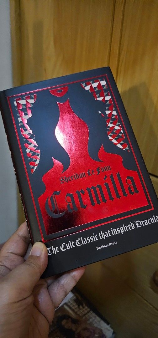 Carmilla by Sheridan Le Fanu (Category: Storybooks) located in San Carlos. Submitted by thearchives13 (Listing ID 1433364720, Image 1). Description: - Carmilla by Sheridan Le Fanu - "The Cult Classic that inspired Dracula" - Features a striking red and black cover design - Clean edges and well-preserved cover.