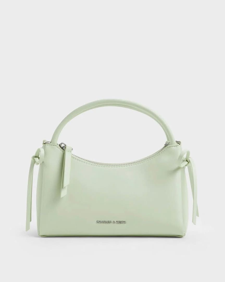 Charles & Keith Hazel Bow TopHandle Bag (Category: Shoulder Bags) located in Pasig City. Submitted by ff.ph (Listing ID 1433391747, Image 1). Description: Top Handle Bag Pastel colors Color Available Mint Green - Soft Pink - Cream With Detachable and Adjustable Strap Material Calf PU Size 21x9x13 cm Zip closure With Echodustbag and serial number Add paperbag plus 80 .