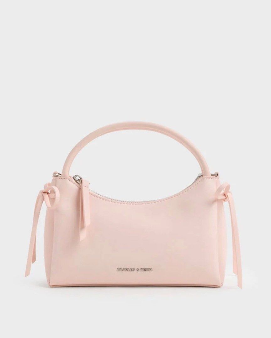 Charles & Keith Hazel Bow TopHandle Bag (Category: Shoulder Bags) located in Pasig City. Submitted by ff.ph (Listing ID 1433391747, Image 3). Description: Top Handle Bag Pastel colors Color Available Mint Green - Soft Pink - Cream With Detachable and Adjustable Strap Material Calf PU Size 21x9x13 cm Zip closure With Echodustbag and serial number Add paperbag plus 80 .