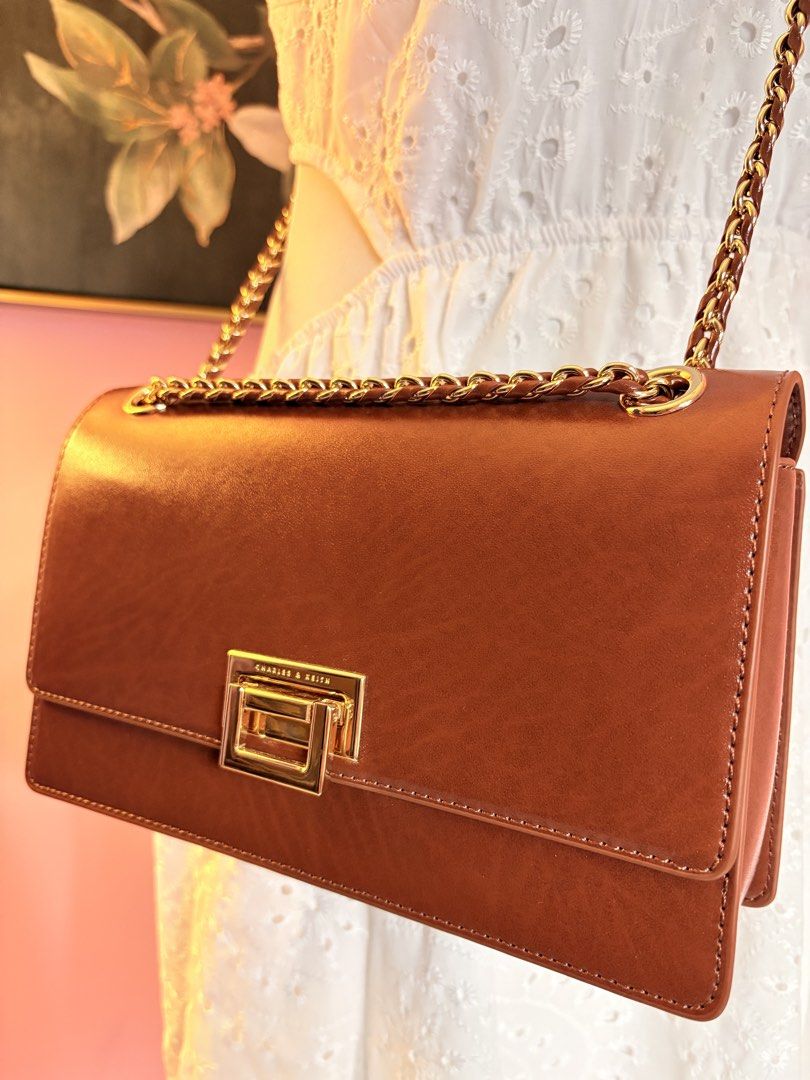 CHARLES AND KEITH TAN BAG MESSENGER TYPE OR SHOULDER BAG (Category: Shoulder Bags) located in Davao. Submitted by flamingopark (Listing ID 1433288587, Image 2). Description: FOR SALE✅ USED ONCE. BOUGHT IN DUBAI. No issue at anything in the bag. RFS—decluttering season! ₱2,000. BOUGHT THIS ROUGLY AROUND 5K in DUBAI. This is good for this upcoming summer getaways! .