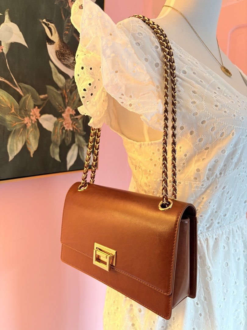 CHARLES AND KEITH TAN BAG MESSENGER TYPE OR SHOULDER BAG (Category: Shoulder Bags) located in Davao. Submitted by flamingopark (Listing ID 1433288587, Image 3). Description: FOR SALE✅ USED ONCE. BOUGHT IN DUBAI. No issue at anything in the bag. RFS—decluttering season! ₱2,000. BOUGHT THIS ROUGLY AROUND 5K in DUBAI. This is good for this upcoming summer getaways! .