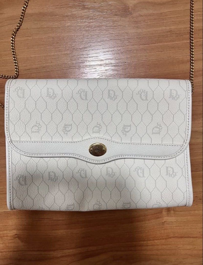 Christian Dior White Crossbody Bag (Category: Luxury Bags & Wallets) located in Manila. Submitted by leanne.closet (Listing ID 1433252109, Image 2). Description: Vintage Christian Dior bag owned by my grandmother. This was bought from USA in the 1990s. The external leather material is still in very good condition, no signs of cracks. The interior has some leather cracks (pls see pics for reference). Aside from the interior leather cracks, no othe